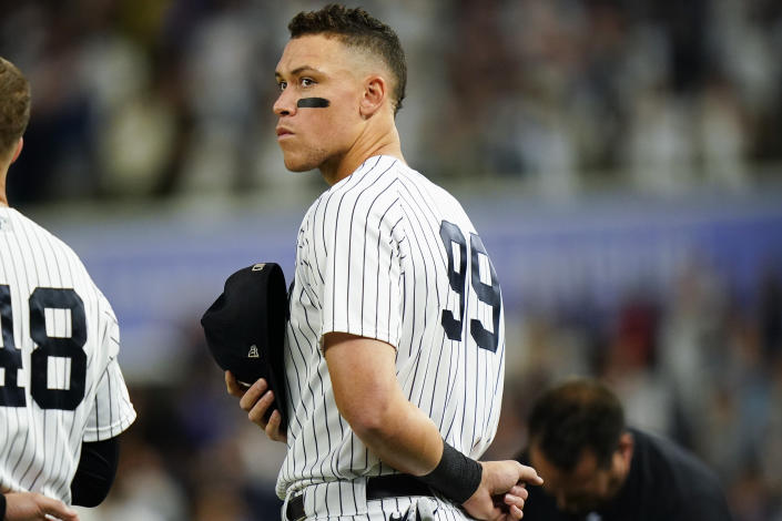 New York Yankees' Aaron Judge stands on the field during the playing of the national anthem before a baseball game against the Boston Red Sox Thursday, Sept. 22, 2022, in New York. (AP Photo/Frank Franklin II)
