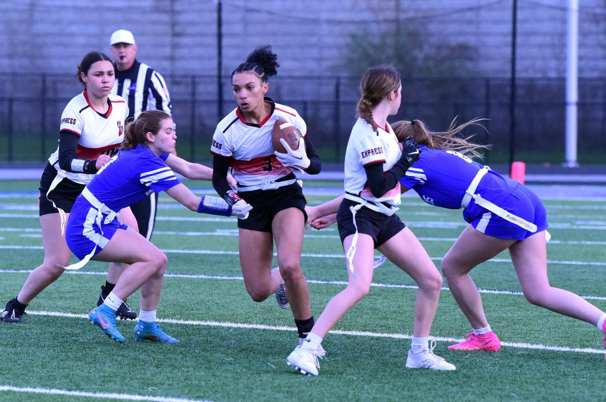 Elmira's Emersyn Garvin carries the ball during a 20-6 win over Horseheads in girls flag football April 17, 2024 at Horseheads High School.