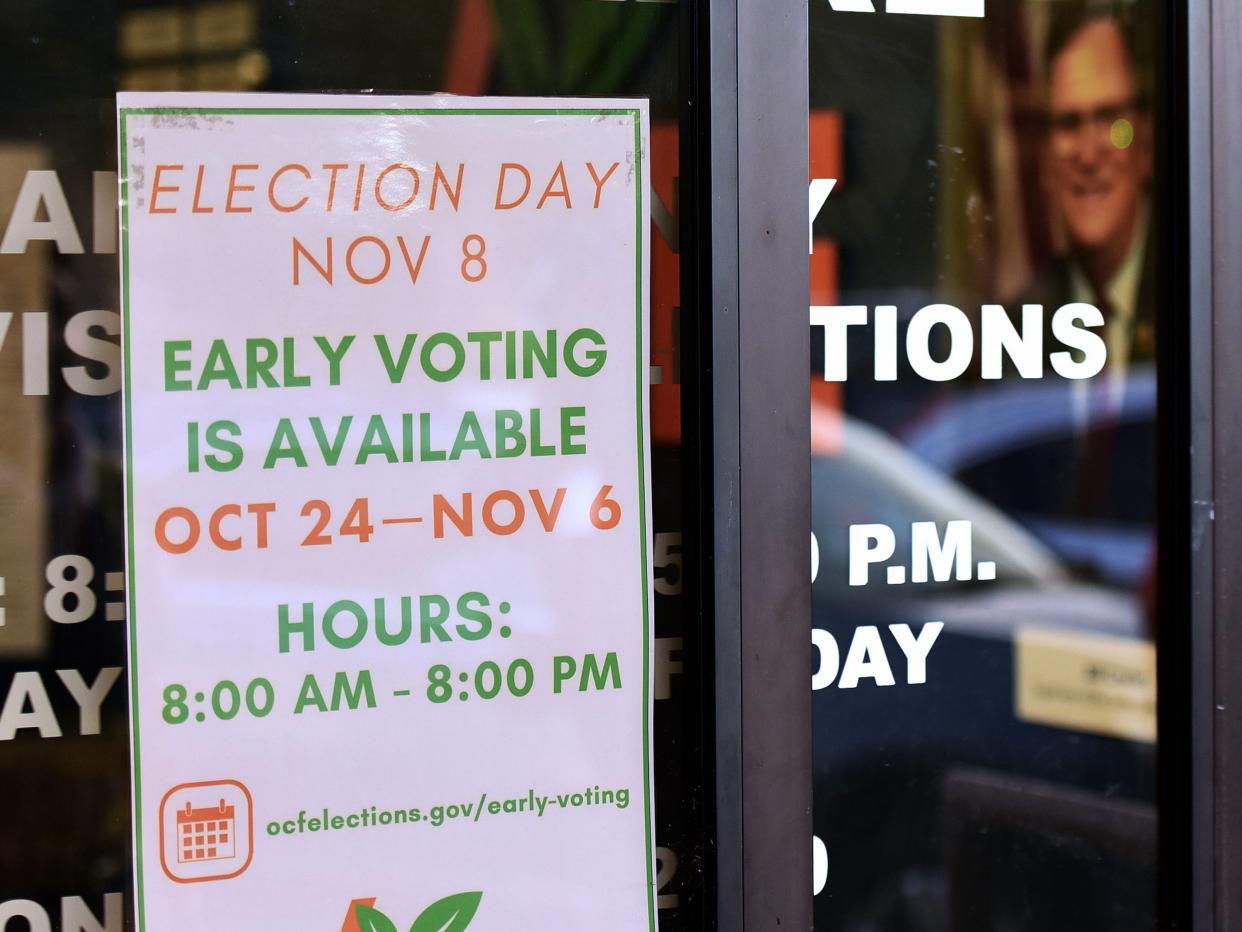 A man enters the Orange County Supervisor of Elections Office on the first day of early voting for the 2022 midterm general election in Orlando.