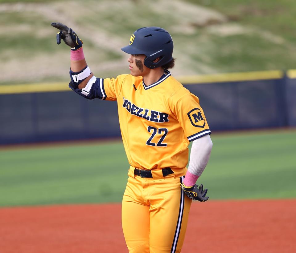 Moeller's Nate Earley reacts after a base hit during their baseball game against St. Xavier Wednesday, March 30, 2022.