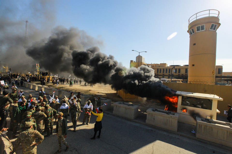 Iraqi Shiite militia supporters burn property during a demonstration inside the US Embassy compound in Baghdad on Dec. 31, 2019.  (Photo: Ameer Al Mohmmedaw/picture alliance via Getty Images)