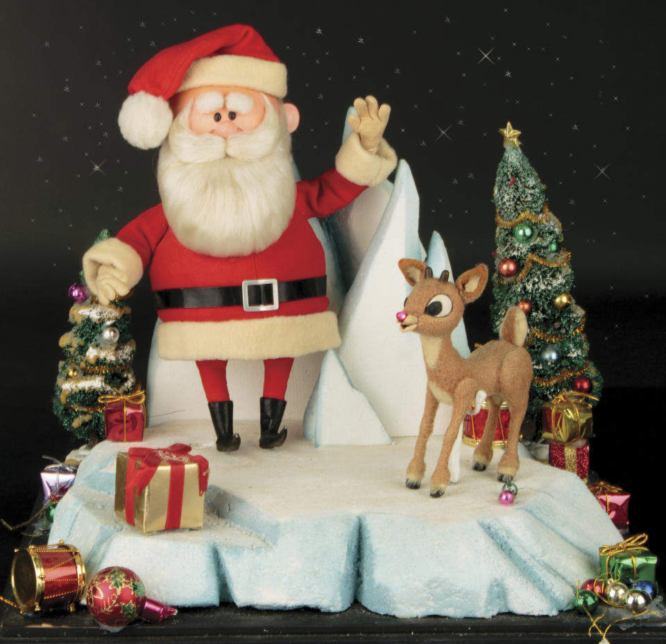 This image released by Profiles in History shows a Santa Clause and Rudolph reindeer puppet used in the filming of the 1964 Christmas special "Rudolph the Red-Nosed Reindeer." The soaring reindeer and Santa Claus figures who starred in in the perennially beloved stop-motion animation Christmas special “Rudolph the Red Nosed Reindeer” are going up for auction.Auction house Profiles in History announced Thursday that a 6-inch-tall Rudolph and 11-inch-tall Santa used to animate the 1964 TV special are being sold together in the auction that starts Nov. 13 and are expected to fetch between $150,000 and $250,000. (Profiles in History via AP)