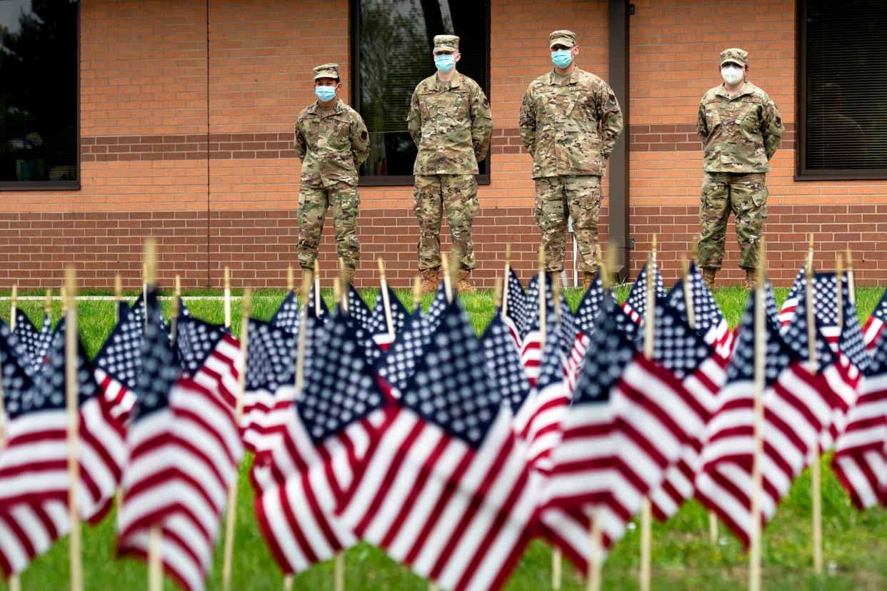 Army National Guard Medics brought in to assist with care at the New Jersey Veterans Home in Paramus pay their respects to the lives lost at the home during a memorial flag ceremony. Members of the Passaic Valley Elks Lodge honored each of the over 100 veterans who have died from COVID-19 at the home with a flag on the front lawn of the home on May 24, 2020.