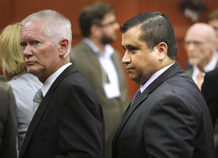 George Zimmerman is escorted from the courtroom a free man after being found not guilty in the 2012 shooting death of Trayvon Martin at the Seminole County Criminal Justice Center in Sanford, Florida, July 13, 2013. REUTERS/Joe Burbank/Pool