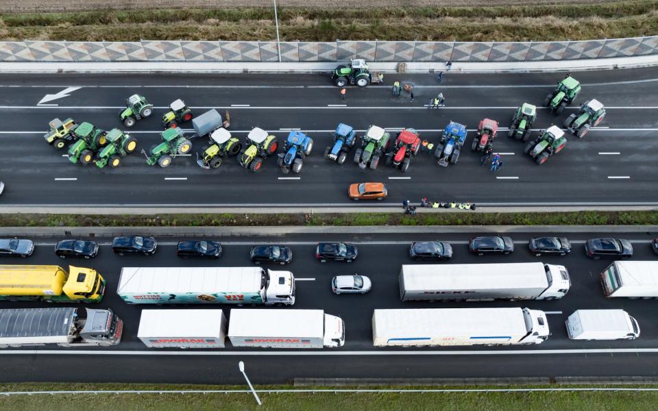 Lorries and tractors blocking the E40 highway during a protest, in Aalter, Belgium, Jan 31