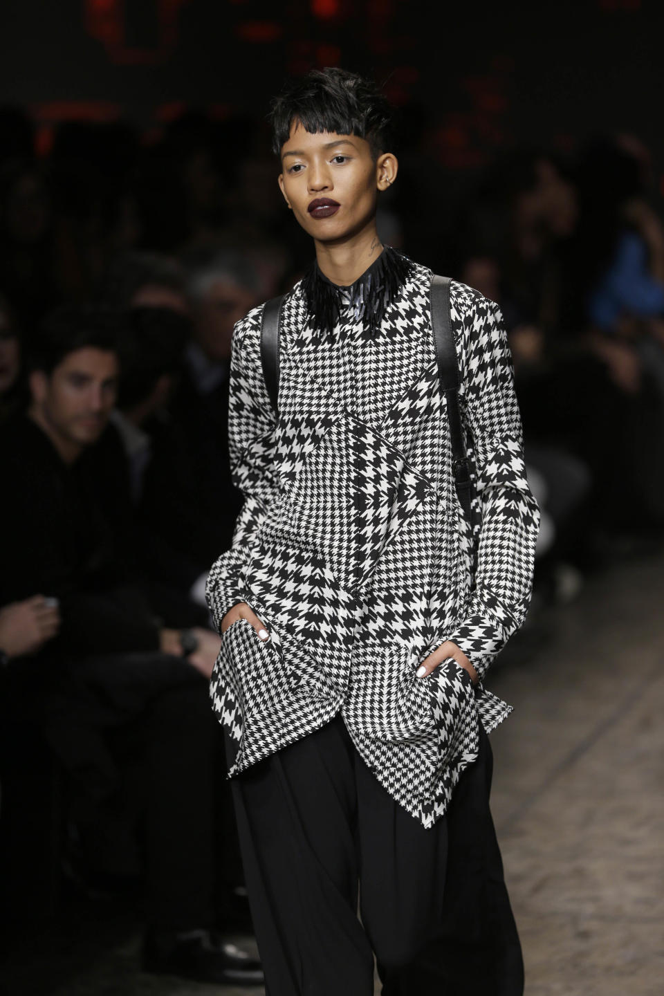 The Fall 2014 DKNY collection is modeled during Fashion Week in New York, Sunday, Feb. 9, 2014. (AP Photo/Seth Wenig)