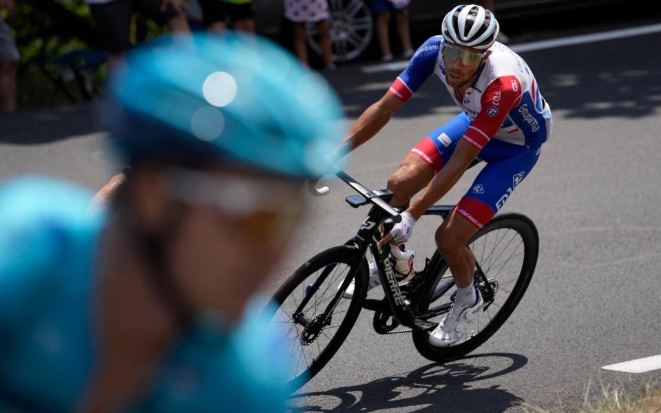 Thibaut Pinot follows Alexey Lutsenko  - AP