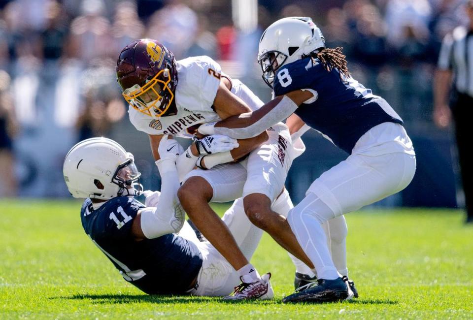 Penn State linebacker Abdul Carter and cornerback Marquis Wilson stop Central Michigan’s Carlos Carriere during the game on Saturday, Sept. 24, 2022.