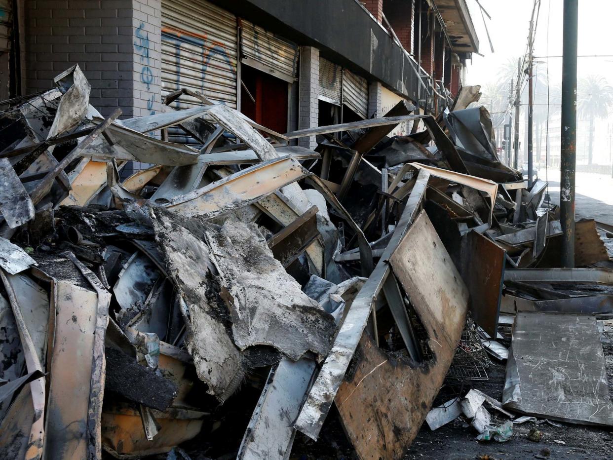 Debris of a burnt and looted supermarket in Chile: REUTERS