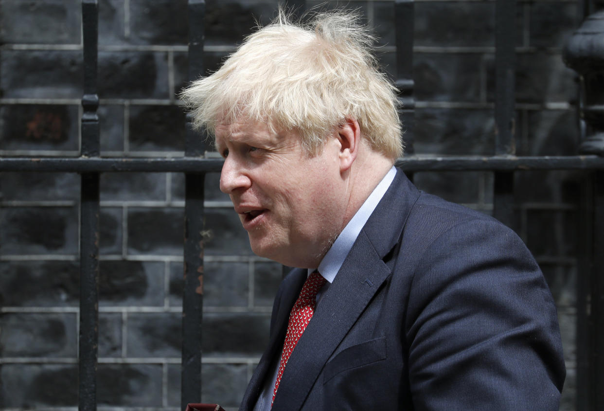 Britain's Prime Boris Johnson leaves 10 Downing Street to attend the weekly Prime Minister's Questions session, in parliament in London, Wednesday, July 15, 2020. (AP Photo/Frank Augstein)