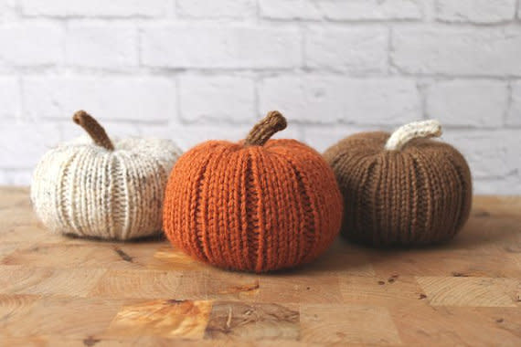 Scatter these <a href="https://www.etsy.com/listing/222427648/fall-decor-stuffed-pumpkins-knit?ga_order=most_relevant&amp;ga_search_type=all&amp;ga_view_type=gallery&amp;ga_search_query=thanksgiving%20table%20decor&amp;ref=sr_gallery_9" target="_blank">knit pumpkins</a> around the table for easy and fun table decorating.