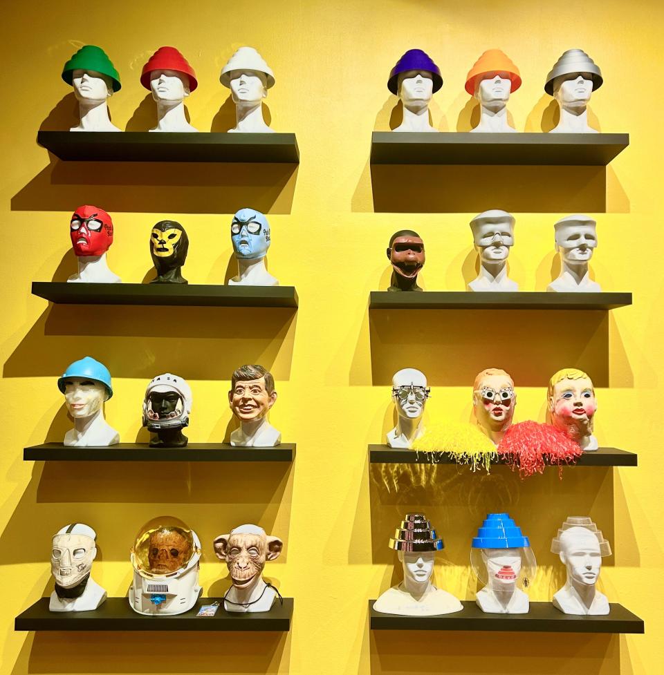 A display of "energy dome" hats and other headgear worn by Devo in music videos and onstage. It's part of the "Devo 5-0" exhibit at Bob Rauschenberg Gallery in south Fort Myers.