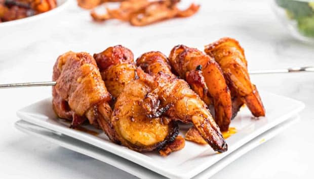<p><a href="https://www.thecountrycook.net/air-fryer-bacon-wrapped-shrimp/" rel="nofollow noopener" target="_blank" data-ylk="slk:The Country Cook;elm:context_link;itc:0;sec:content-canvas" class="link ">The Country Cook</a></p>