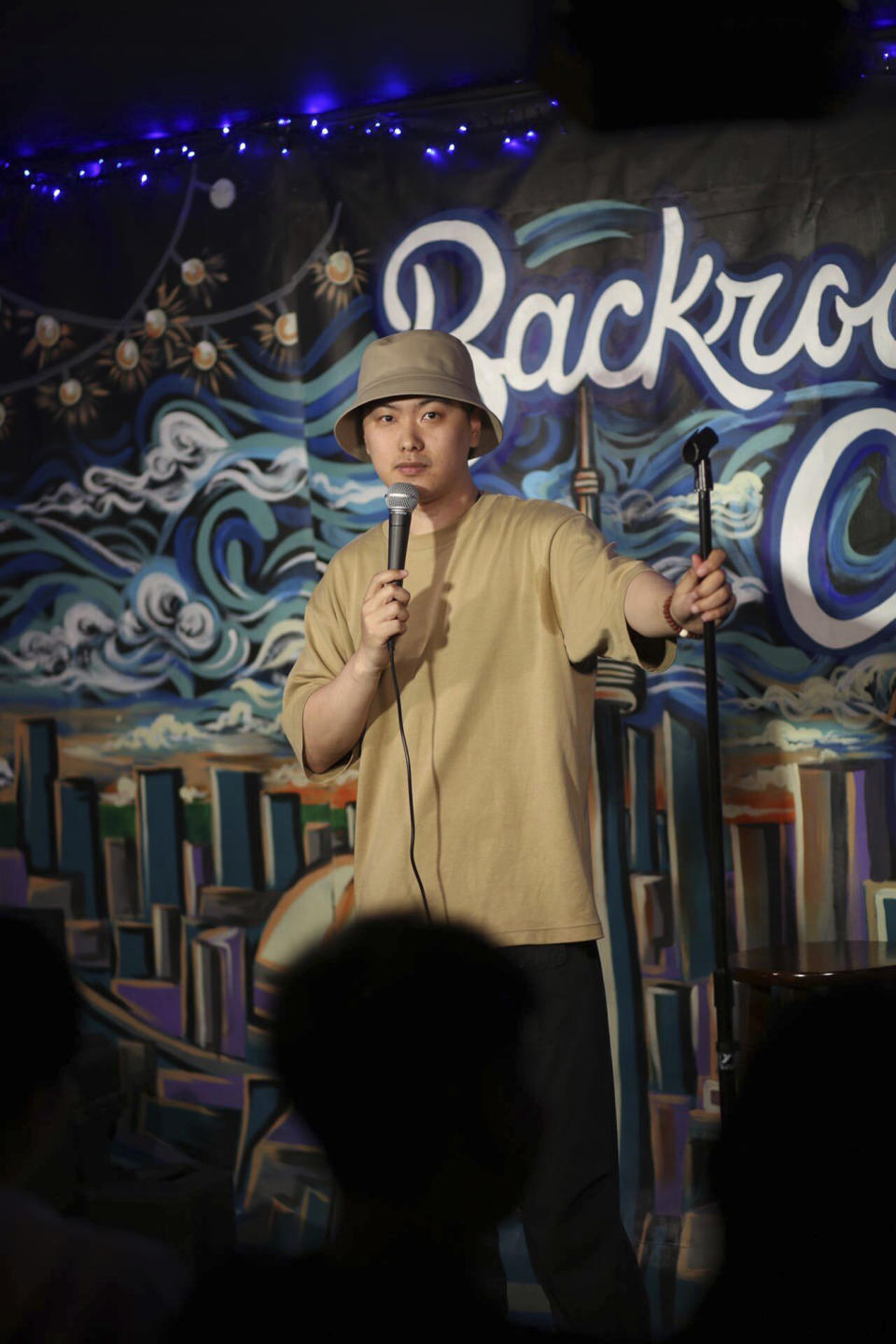 In this photo provided by comedian Lin Dongxiao, who uses the stage name Guazi, Lin performs standup in Toronto, Saturday, June 10, 2023. Lin moved back to China to pursue a career in standup comedy. (Courtesy of Lin Dongxiao via AP)