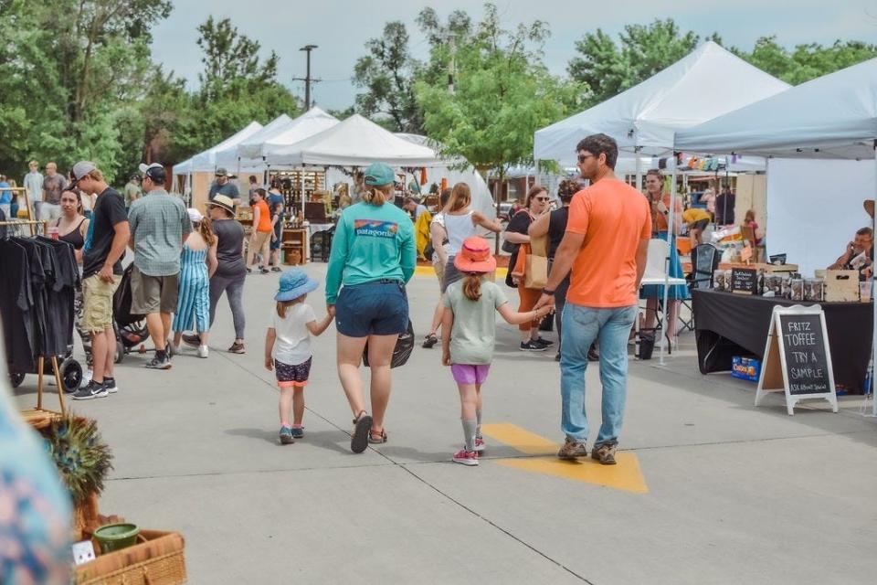 Shoppers enjoy a Sunday afternoon at Beautiful Land Market in downtown Ames. The first market of the season will be held from 11 a.m. to 4 p.m. Sunday.