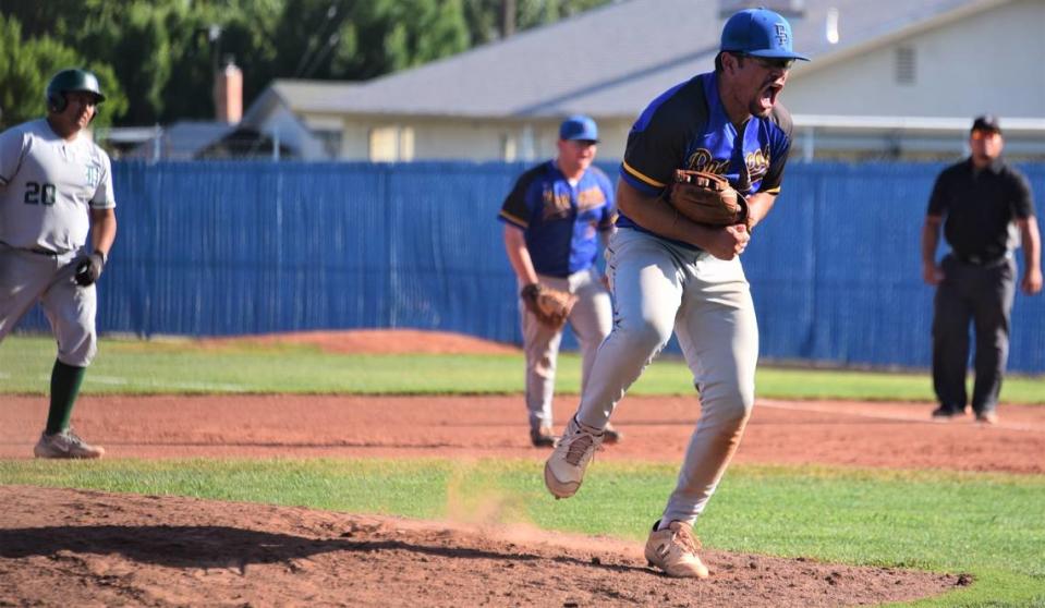 Dos Palos High School pitcher Isac Mandujano reacts after recording a strikeout to get out of a jam in the fourth inning during the Central Section Division III semifinal playoff game against Dinuba on Tuesday, May, 23, 2023 at Dos Palos High School.