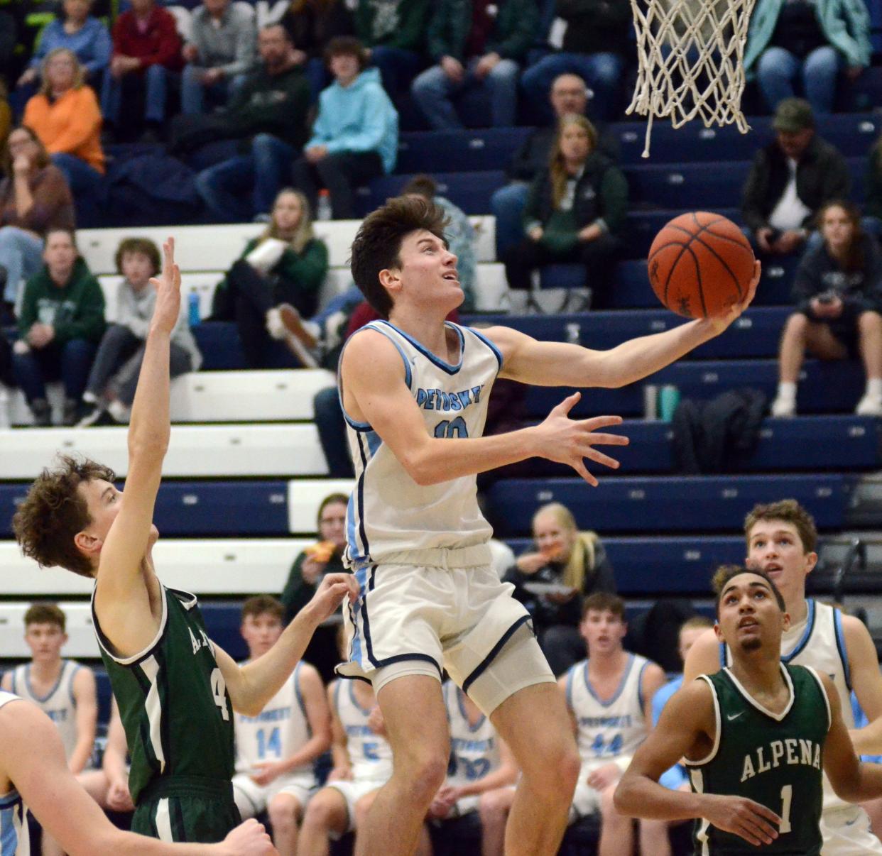 Petoskey's Jimmy Marshall drives and scores through the Alpena defense during the start of the second half against the Wildcats Friday.