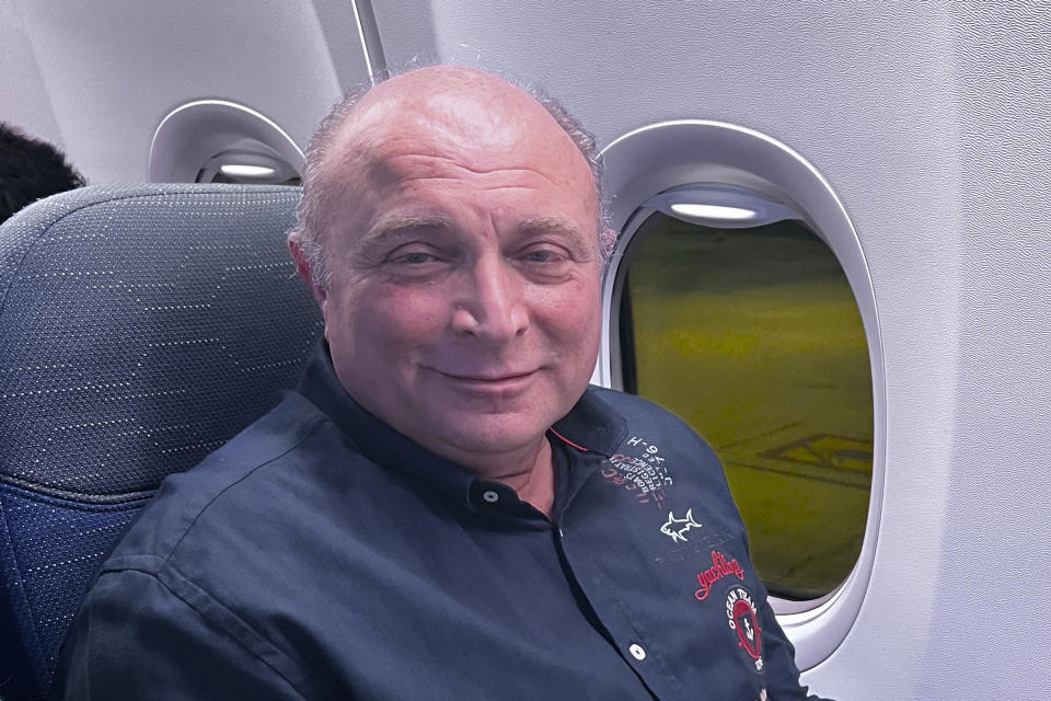 This photo provided by the family of Ziad Auf shows Auf, a port official who was detained three days after the Aug. 4, 2020, explosion at the port of Beirut, Lebanon, sitting in an airplane at Beirut's Rafik Hariri International Airport following his release, Wednesday, Jan. 25, 2023. Auf's release came after threats of U.S. sanctions against any Lebanese official who is proven to be responsible for the 62-year-old man's "unlawful detention," said Nizar Zakka, president of the U.S.-based Hostage Aid Worldwide, whose mission is to assist hostages held around the world. (Courtesy of the Auf Family via AP)