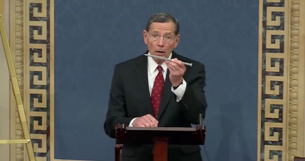 Sen. John Barrasso holds up a tree spike during a July 28 speech on the Senate floor in which he condemned Stone-Manning's nomination to lead the Bureau of Land Management. (Photo: Screenshot/Senate.gov)