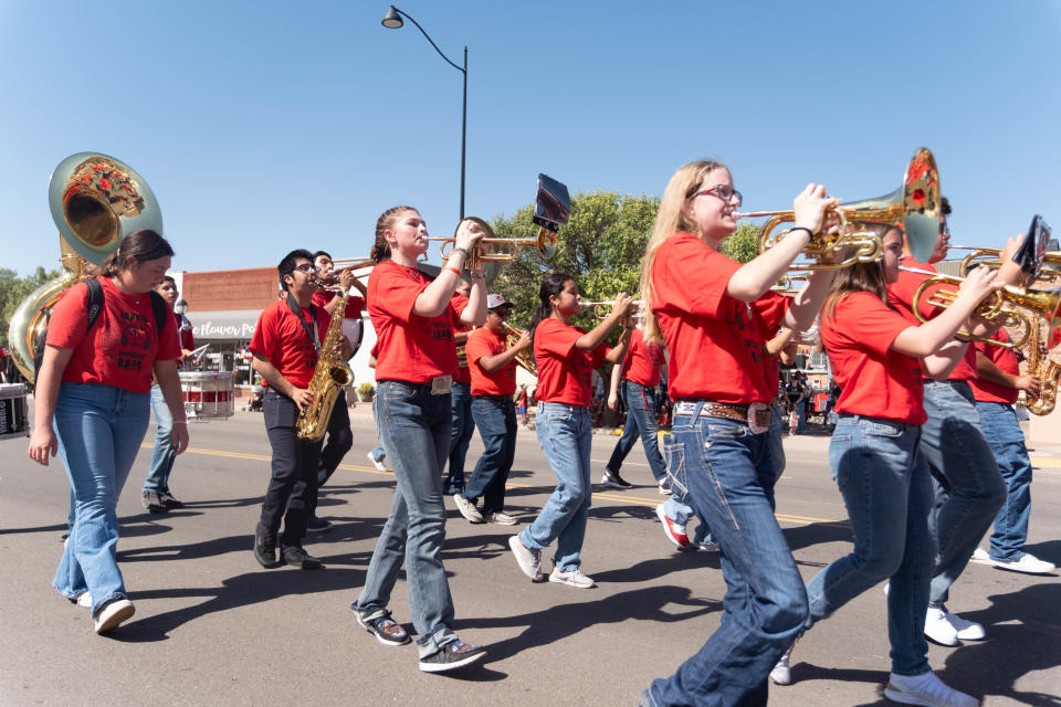 The Liberal High School Marching Band from Kansas gives the crowd a little flare at the 104th annual Wheatheart of the Nation Parade Saturday in Perryton.