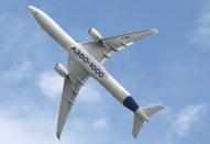 An Airbus A350-1000 performs at the 53rd International Paris Air Show at Le Bourget Airport near Paris