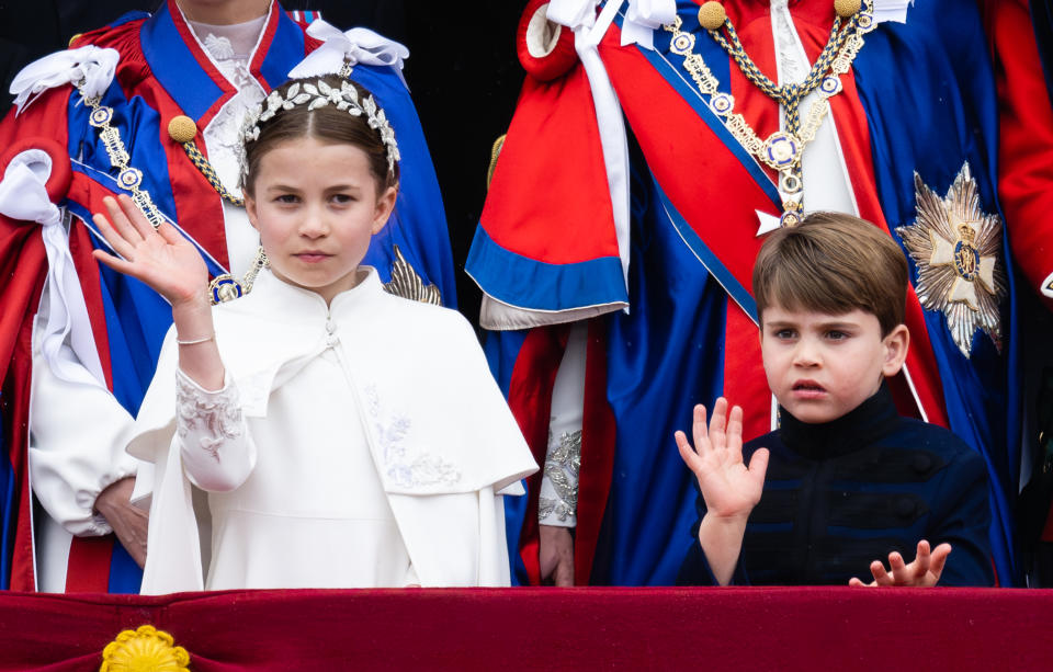 LONDON, ENGLAND - MAY 06:  Princess Charlotte and Prince Louis on the balcony of Buckingham Palace, London, following the coronation on May 06, 2023 in London, England. The Coronation of Charles III and his wife, Camilla, as King and Queen of the United Kingdom of Great Britain and Northern Ireland, and the other Commonwealth realms takes place at Westminster Abbey today. Charles acceded to the throne on 8 September 2022, upon the death of his mother, Elizabeth II.  (Photo by Samir Hussein/WireImage)