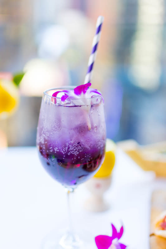 <p>Dream Midtown</p><p>This might just be the prettiest aperitivo we've ever seen. This cocktail gets its stunning violet color from Crème de Violette and a nice fizz from Prosecco and club soda.</p><p>Recipe Courtesy of <a href="https://www.dreamhotels.com/midtown/default-en.html" rel="nofollow noopener" target="_blank" data-ylk="slk:Dream Midtown;elm:context_link;itc:0;sec:content-canvas" class="link rapid-noclick-resp">Dream Midtown</a> in Manhattan, NY:</p><p>• 1 oz gin </p><p>• 1 oz Crème de Violette </p><p>• .5 oz lemon </p><p>• Top with splash of Prosecco, splash of club soda and flowers</p>