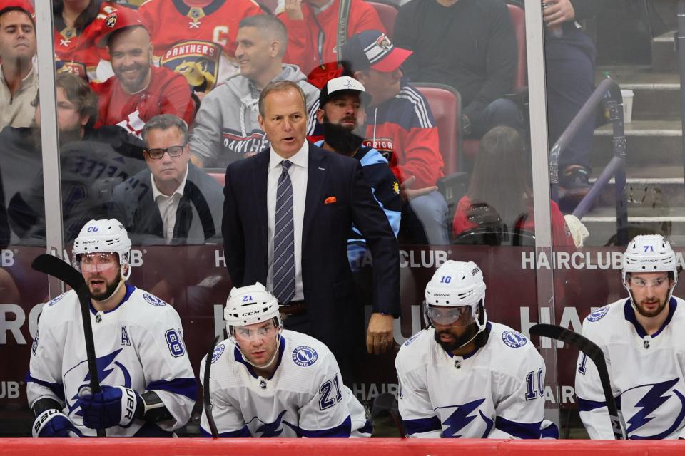 Lightning coach Jon Cooper looks on from the bench during Game 2 of Tampa Bay's first-round Stanley Cup Playoff series against the Florida Panthers.