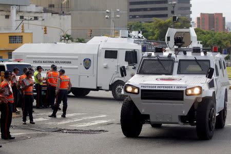 Riot police vehicles patrol during a rally to demand a referendum to remove Venezuela's President Nicolas Maduro in Caracas, Venezuela, September 1, 2016. REUTERS/Christian Veron