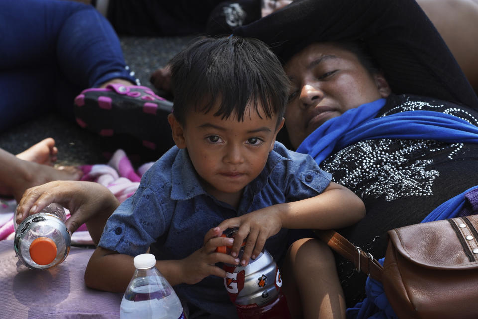 A child, who is part of a migrant caravan on a trek to the U.S. border, rests on the outskirts of Villa Comaltitlan, Chiapas state, Mexico, Wednesday, Oct. 27, 2021. (AP Photo/Marco Ugarte)