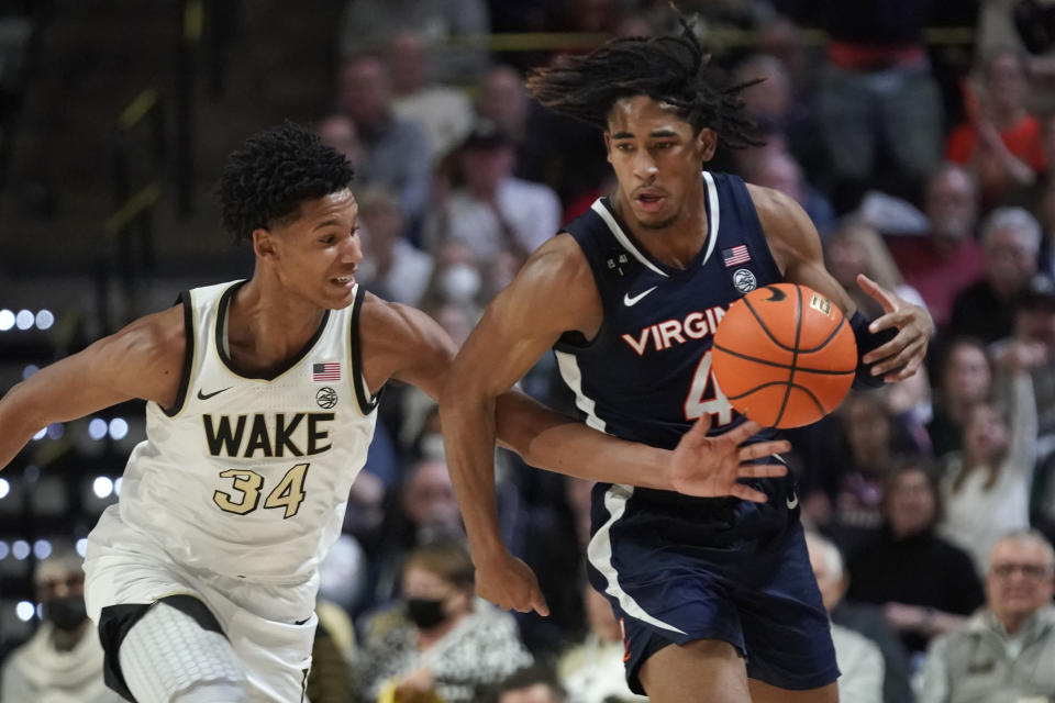 Virginia guard Armaan Franklin (4) is fouled by Wake Forest forward Bobi Klintman (34) during the second half of an NCAA college basketball game in Winston-Salem, N.C., Saturday, Jan. 21, 2023. (AP Photo/Chuck Burton)