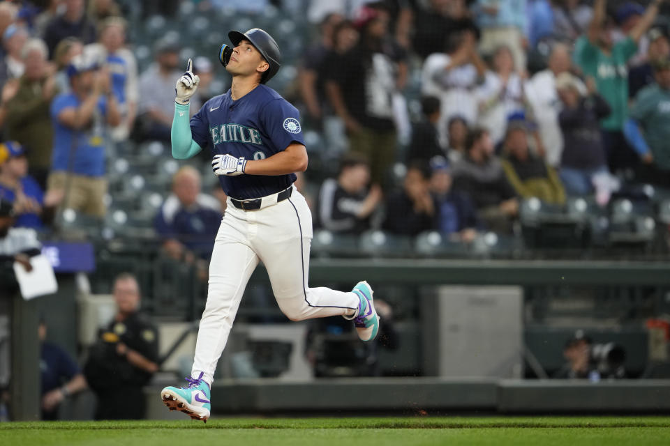 Seattle Mariners' Dominic Canzone celebrates as he jogs home after hitting a home run against the Chicago White Sox during the eighth inning of a baseball game Monday, June 10, 2024, in Seattle. (AP Photo/Lindsey Wasson)