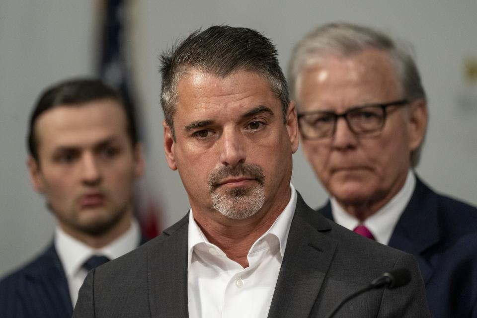 Christopher Braden, survivor of the Buffalo supermarket shooting, listens during a press conference , Wednesday, July 12, 2023, in Buffalo, N.Y. Victims and relatives of last year's mass shooting at a Buffalo supermarket announced Wednesday they are suing the social media sites, weapons retailers and others who they say “loaded the gun” the assailant used to kill 10 Black people and wound three other victims in an attack fueled by racist conspiracy theories he encountered online. (Libby March/The Buffalo News via AP)