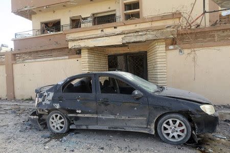A car damaged by an explosion is pictured in Benghazi February 6, 2015. REUTERS/Esam Omran Al-Fetori