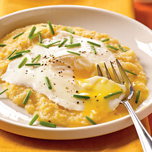 Eggs Blindfolded over Garlic-Cheddar Grits