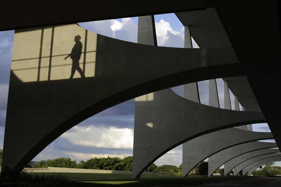 A woman's silhouette is seen at the Planalto Palace in Brasilia April 2, 2014. Brasilia is one of the host cities for the 2014 soccer World Cup in Brazil. REUTERS / Ueslei Marcelino (BRAZIL - Tags: SPORT SOCCER WORLD CUP SOCIETY)