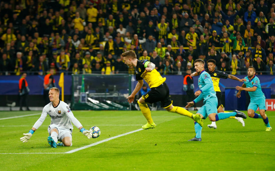 Soccer Football - Champions League - Group F - Borussia Dortmund v FC Barcelona - Signal Iduna Park, Dortmund, Germany - September 17, 2019  Barcelona's Marc-Andre ter Stegen saves a shot from from Borussia Dortmund's Marco Reus   REUTERS/Thilo Schmuelgen