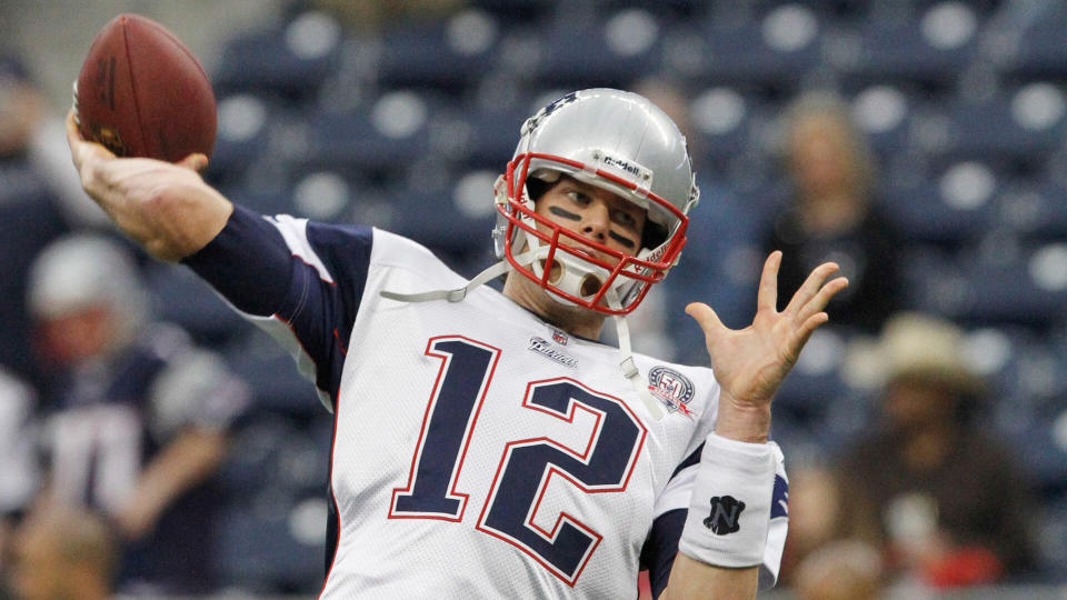 Mandatory Credit: Photo by Donna Mcwilliam/AP/Shutterstock (9274107ab)New England Patriots' quarterback Tom Brady (12) warms up before the NFL football game against the Houston Texans NFL football game in HoustonPatriots Texans Football, Houston, USA - 3 Jan 2010.