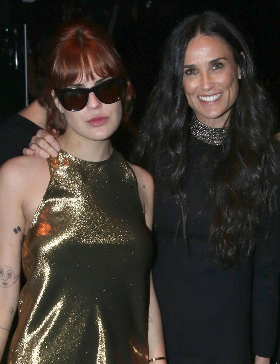 Tallulah Willis, left, and Demi Moore attend Saint Laurent at the Palladium on Wednesday, Feb. 10, 2016 in Los Angeles. (Photo by Matt Sayles/Invision/AP)