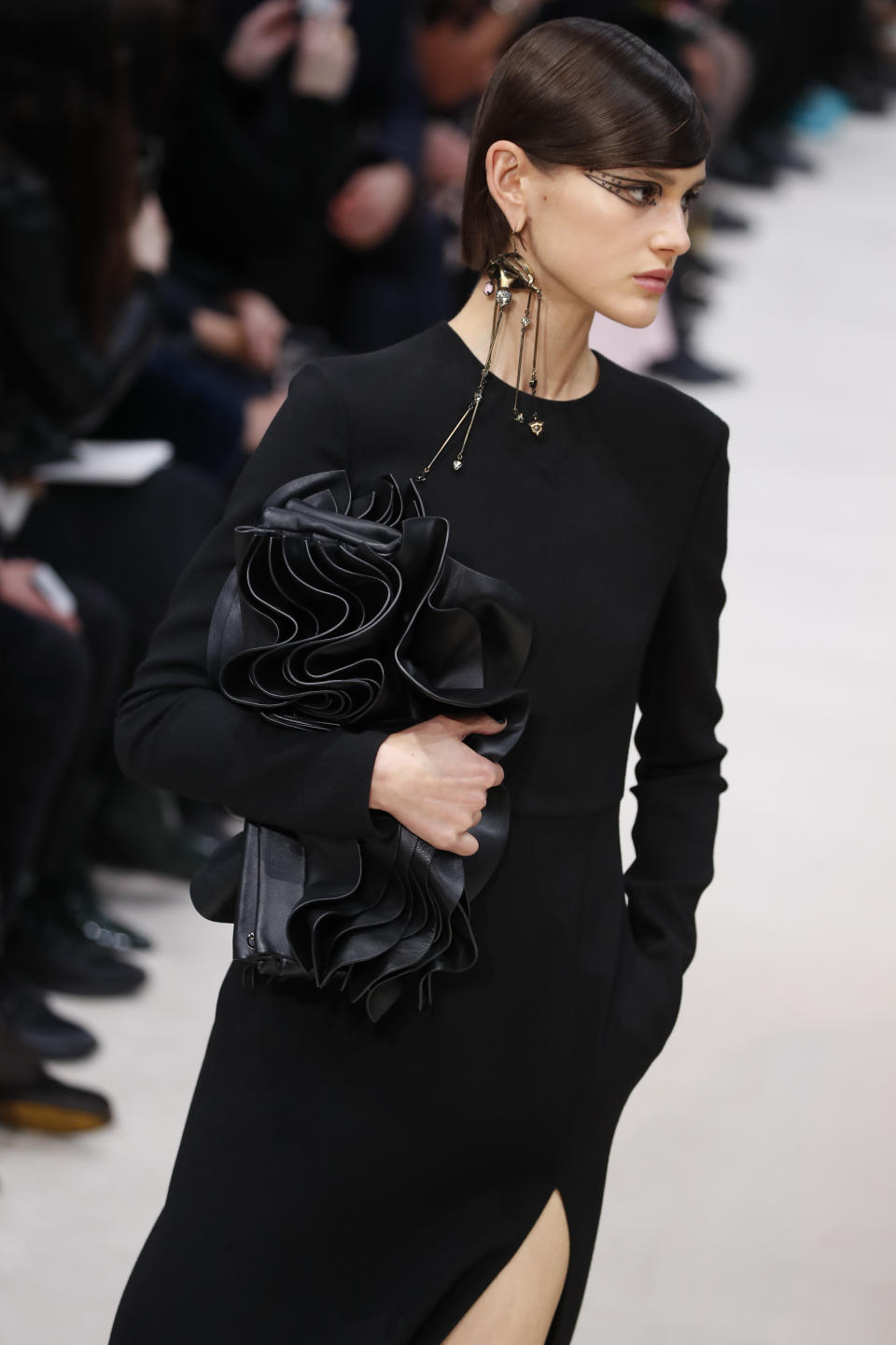 A model wears a creation for the Valentino fashion collection during Women's fashion week Fall/Winter 2020/21 presented in Paris, Sunday, March 1, 2020. (AP Photo/Francois Mori)