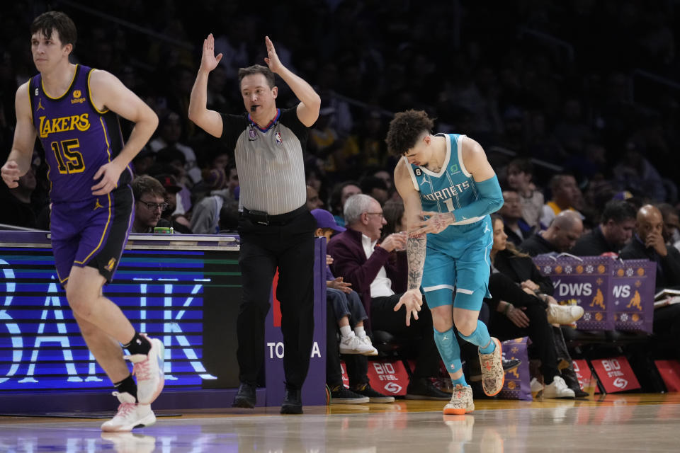 Charlotte Hornets guard LaMelo Ball (1) reacts after making a 3-point basket during the first half of the team's NBA basketball game Los Angeles Lakers on Friday, Dec. 23, 2022, in Los Angeles. (AP Photo/Marcio Jose Sanchez)