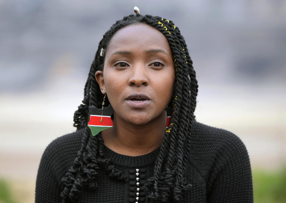 FILE - Activist Elizabeth Wathuti from Kenia talks to the media at the Garzweiler open-cast coal mine near Luetzerath, western Germany, Oct. 16, 2022. In India, it's record heat connected to climate change that caused deaths and ruined crops. “Loss and damage is going to be the priority and the defining factor of whether or not COP27 succeeds,” Wathuti said. (AP Photo/Martin Meissner, File)