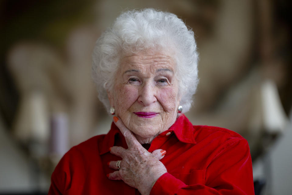 Longtime crossword constructor Bernice Gordon born on Jan. 11, 1914, poses for a portrait at her home, Tuesday, Dec. 31, 2013, in Philadelphia. The New York Times is scheduled publish one of her puzzles, making her the first centenarian ever to have a grid printed in the paper. Gordon’s feat comes not long after the centennial of the puzzle itself. (AP Photo/Matt Rourke)