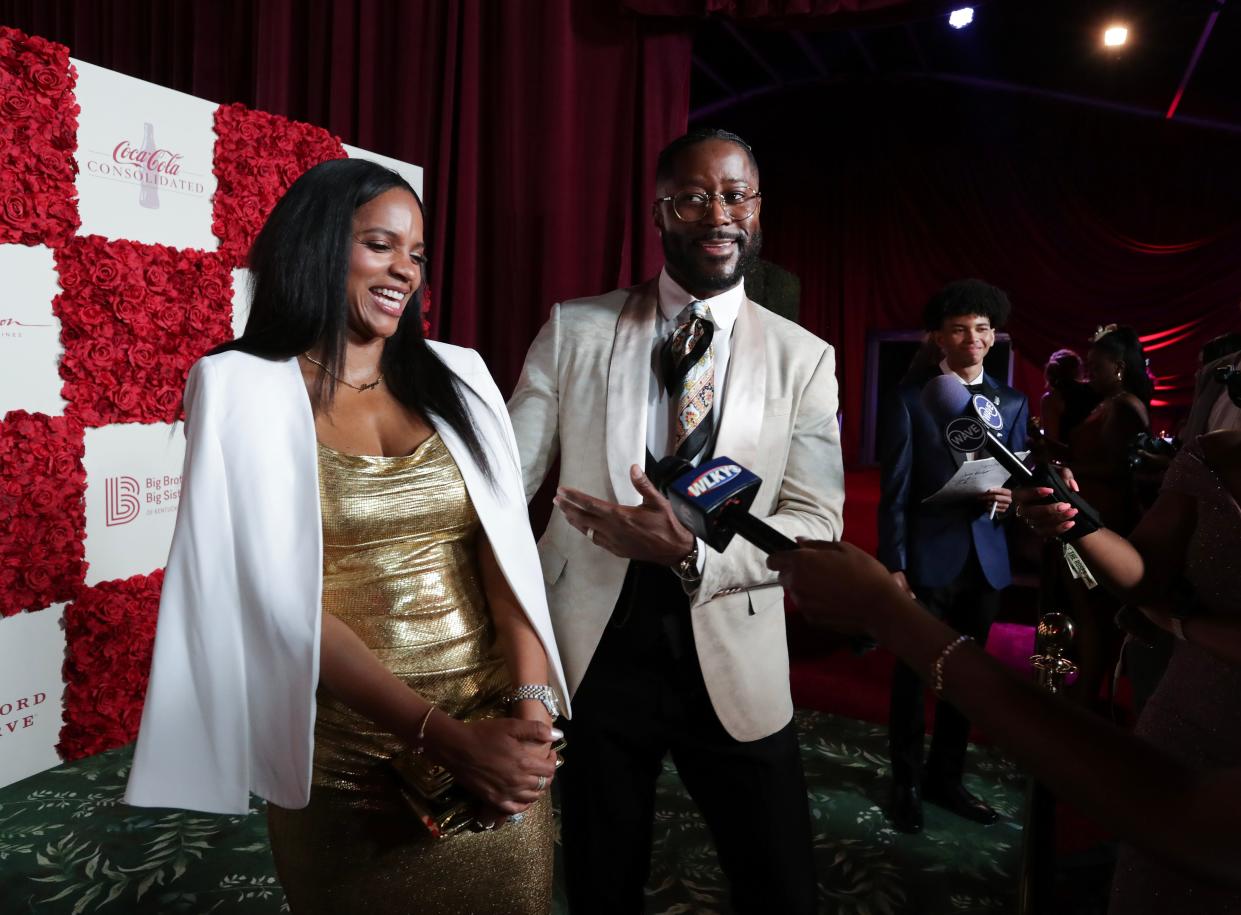 CBS Mornings co-host Nate Burleson, right, and his wife Atoya Burleson arrive on the red carpet during the Trifecta Gala in Louisville, Ky. on May. 3, 2024.