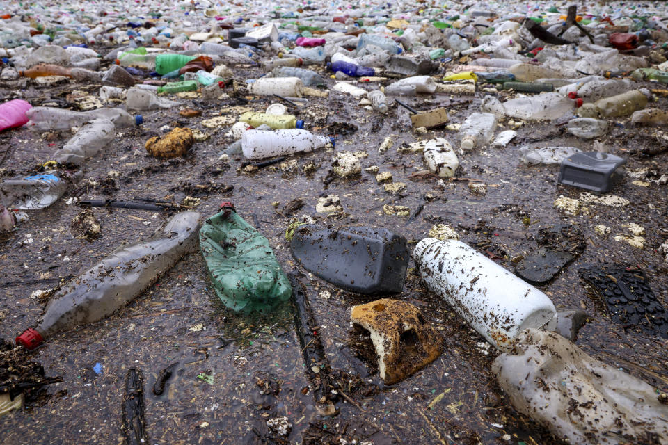 Waste float in the Drina river near Visegrad, Bosnia, Wednesday, Jan. 10, 2024. Tons of waste dumped in poorly regulated riverside landfills or directly into the rivers across three Western Balkan countries end up accumulating during high water season in winter and spring, behind a trash barrier in the Drina River in eastern Bosnia. (AP Photo/Armin Durgut)