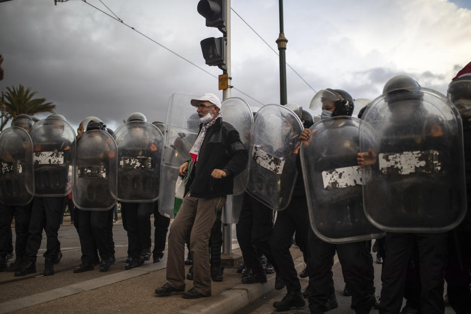 A man protest against the visit of Israeli Defence Minister Benny Gantz to Morocco in Rabat, Wednesday, Nov. 24, 2021. Israel and Morocco signed a landmark agreement Wednesday that lays the foundation for security cooperation, intelligence sharing, and future arms sales. (AP Photo/Mosa'ab Elshamy)