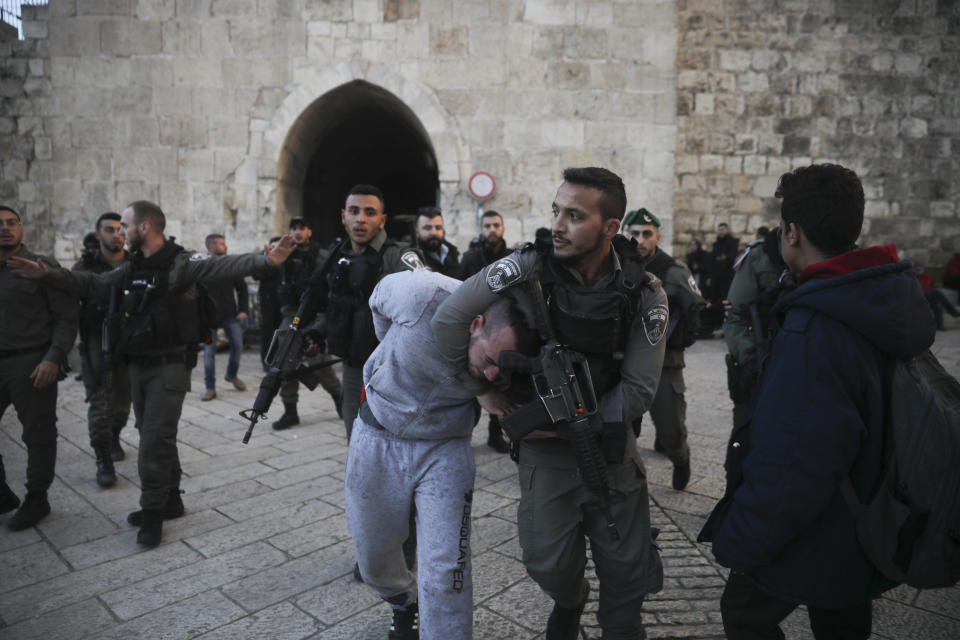 Israeli border police arrests a Palestinian ahead of a protest against Middle East peace plan announced Tuesday by US President Donald Trump, which strongly favors Israel, in Jerusalem, Wednesday, Jan 29, 2020. (AP Photo/Mahmoud Illean)