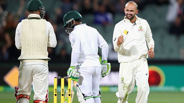 Lyon (right) celebrates a wicket in the day-night Adelaide Test. Image: Getty