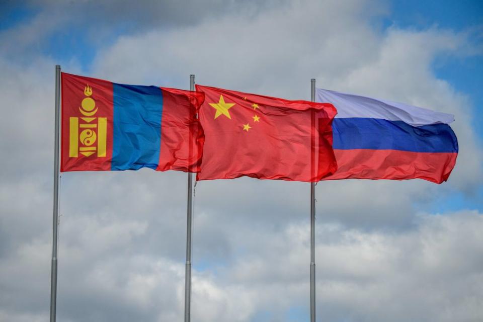 The flags of Mongolia, China and Russia fly in the wind during the Vostok-2018 (East-2018) military drills at Tsugol training ground not far from the borders with China and Mongolia in Siberia, on September 13, 2018.<span class="copyright">MLADEN ANTONOV/AFP via Getty Images</span>