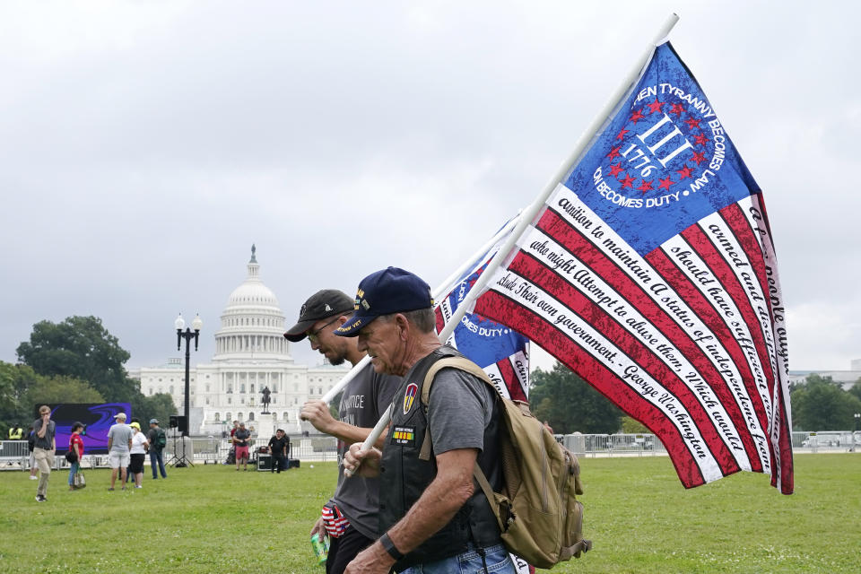 People arrive to attend a rally near the U.S. Capitol in Washington, Saturday, Sept. 18, 2021. The rally was planned by allies of former President Donald Trump and aimed at supporting the so-called "political prisoners" of the Jan. 6 insurrection at the U.S. Capitol. (AP Photo/Alex Brandon)